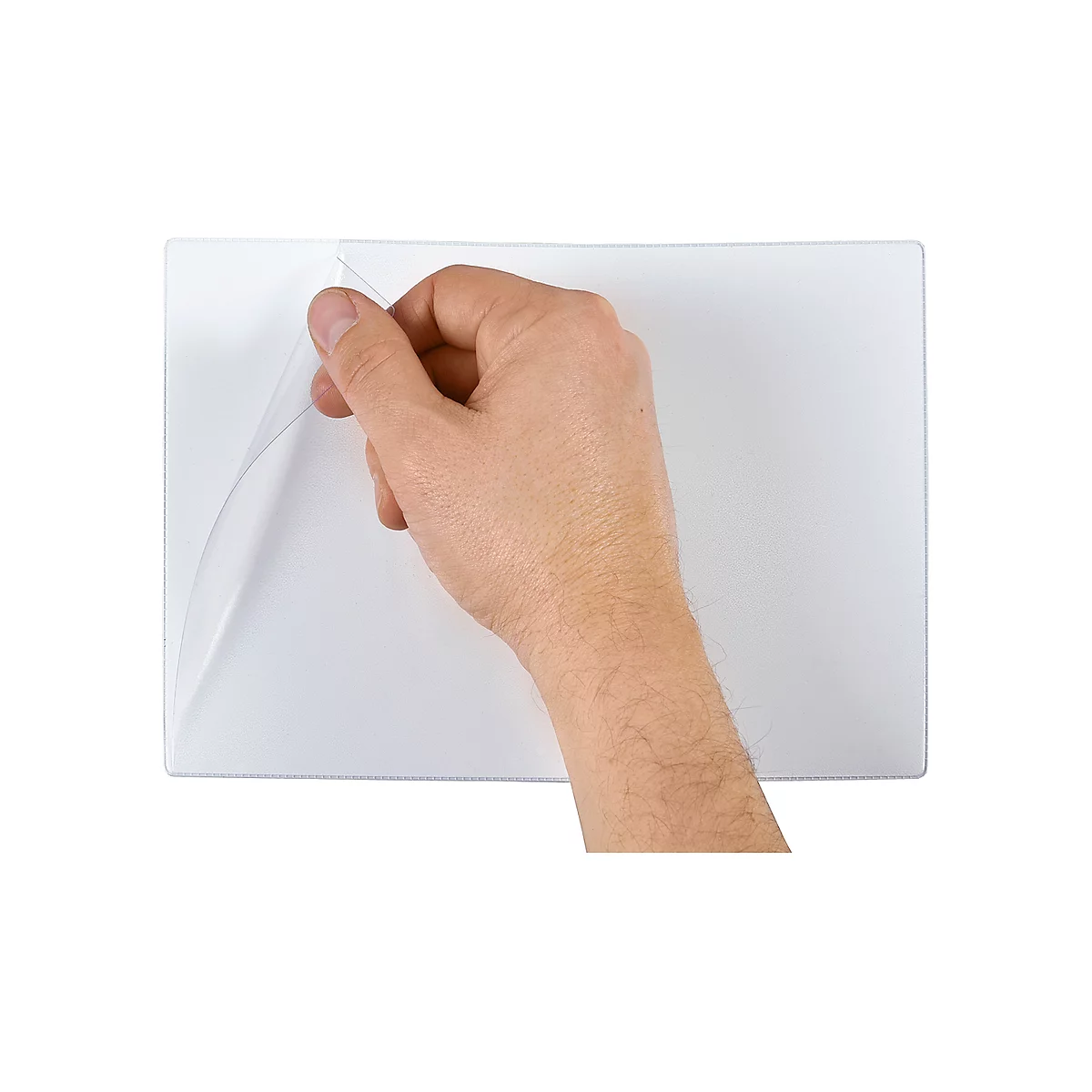 Hand peeling up corner of a transparent white film on white background.