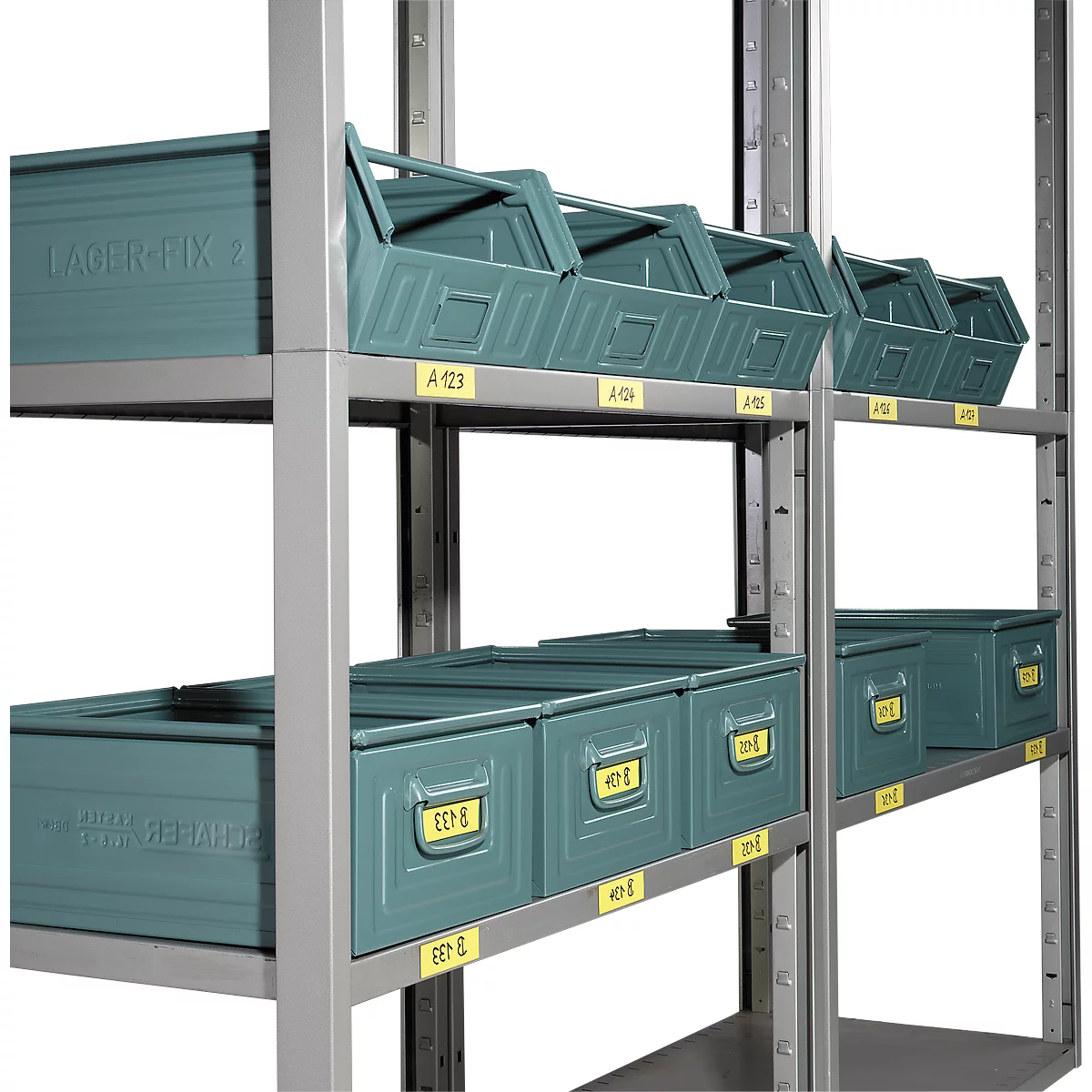 Shelving unit with green storage bins. Yellow labels with letter and number combinations are visible on the bins and shelving.