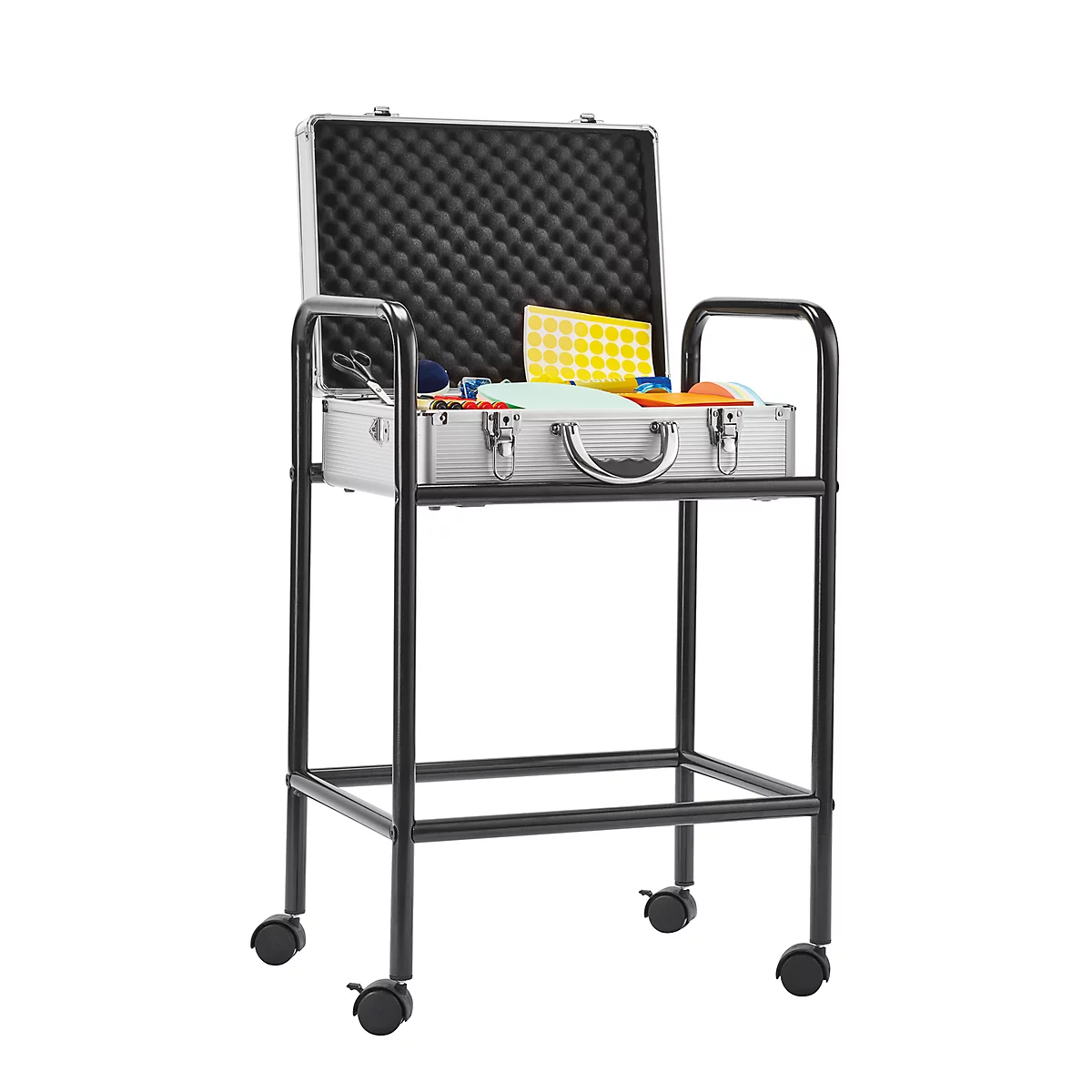 An open silver suitcase on a black serving cart. The suitcase is filled with tools and materials.