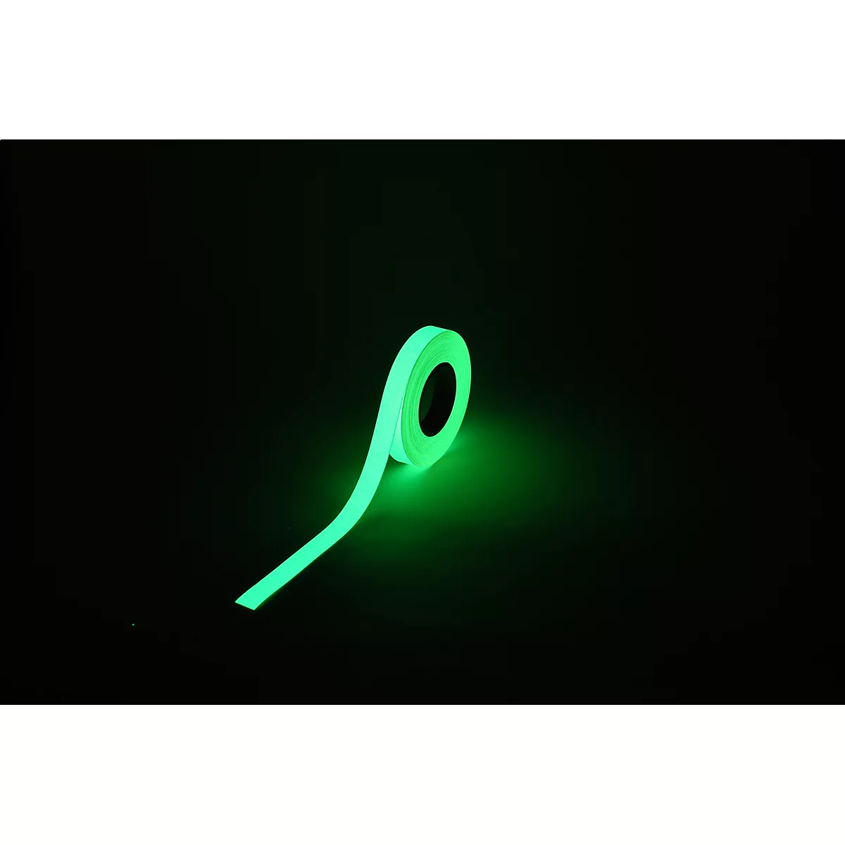 Glowing tape roll. Green tape on a black background, glows in the dark.