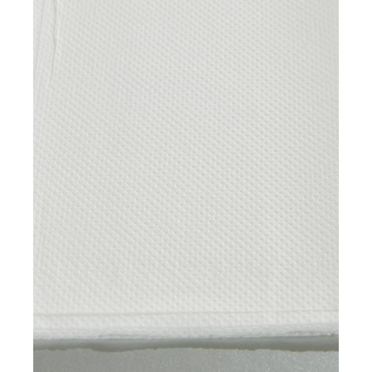 Close-up van een witte, getextureerde stof met een honingraatpatroon.