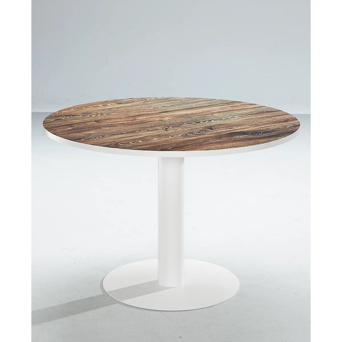Round table with wooden top and white base. The table is in front of a white background.