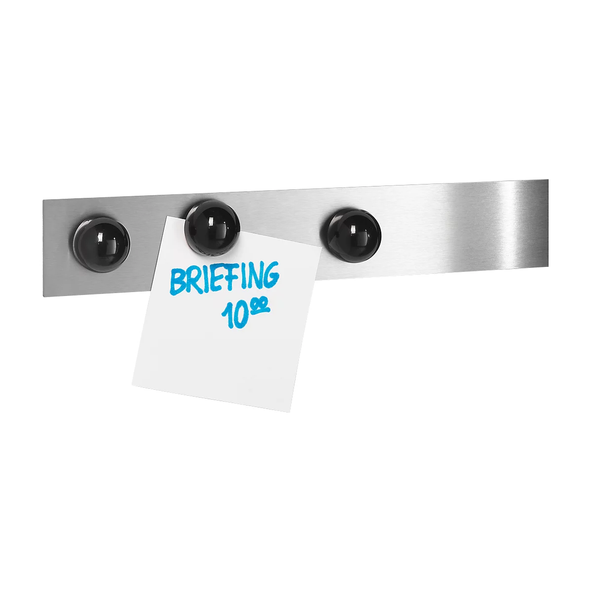 Magnetic metal strip with black magnets holding a white memo with blue text. The memo says: BRIEFING 10:00.