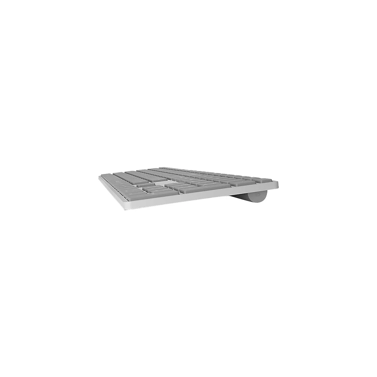 Seitenansicht einer flachen, silbernen Computertastatur mit grauen Tasten auf weißem Hintergrund.