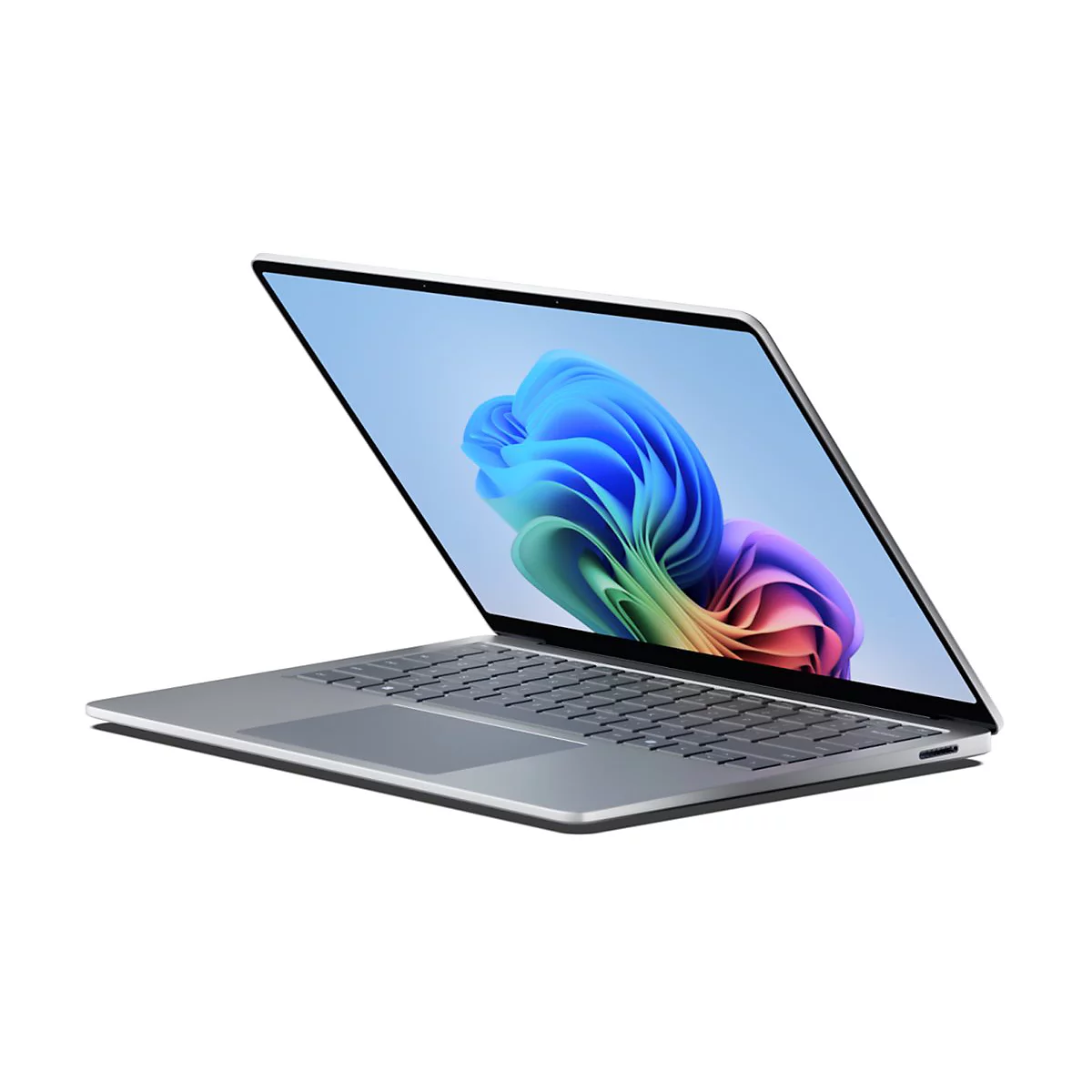 Ein silberner Laptop ist leicht geÃ¶ffnet, der Bildschirm zeigt ein buntes abstraktes Design.