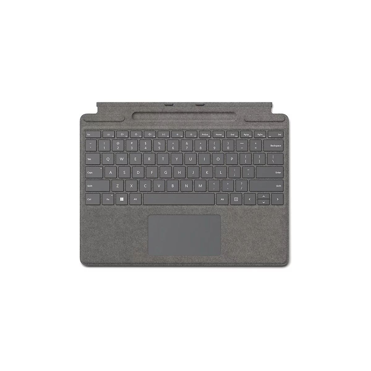 Dunkelgraue Microsoft Surface Tastatur von oben, mit integriertem Touchpad auf strukturiertem Stoffhintergrund.