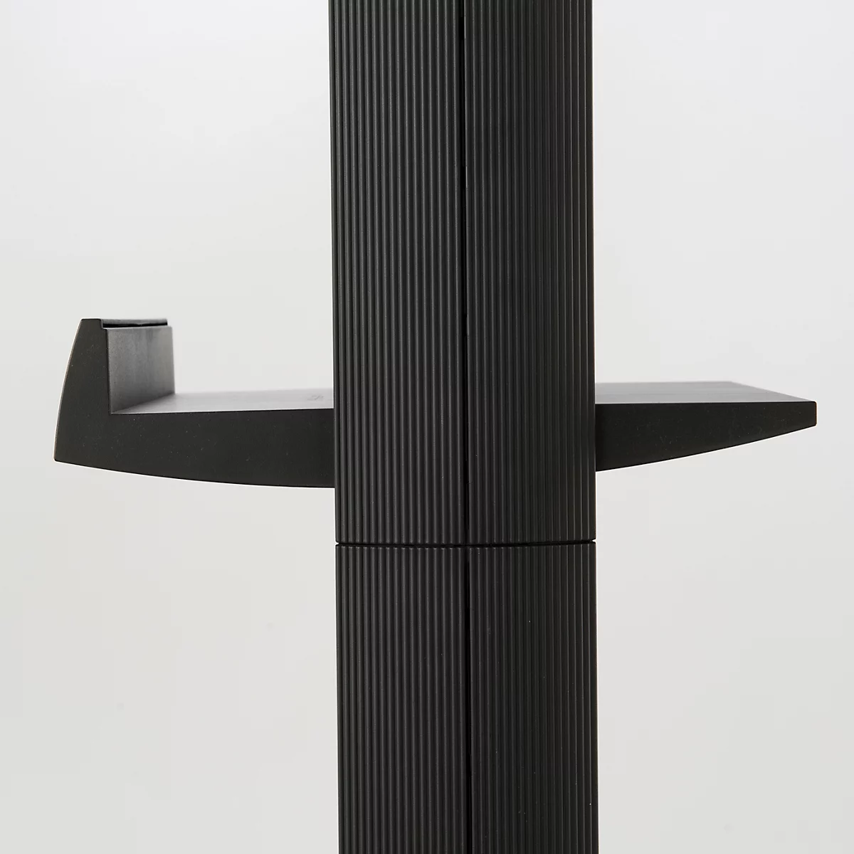 Black furniture with ribbed surface, two horizontal and one vertical plate.