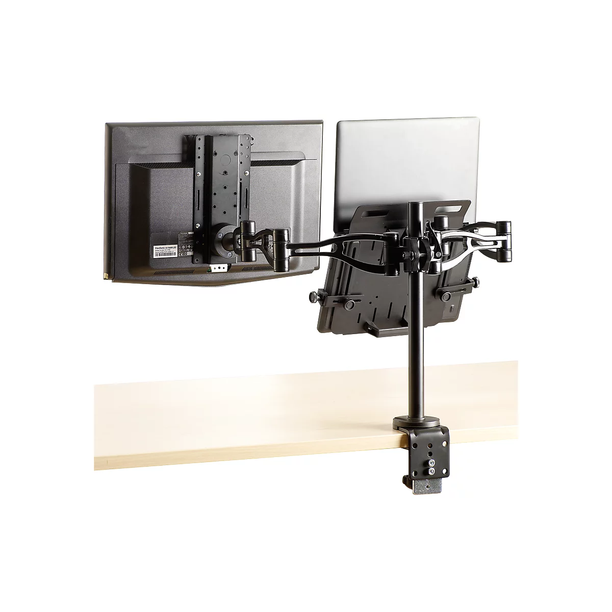 A mounting system for a monitor and a laptop, fixed to a tabletop.