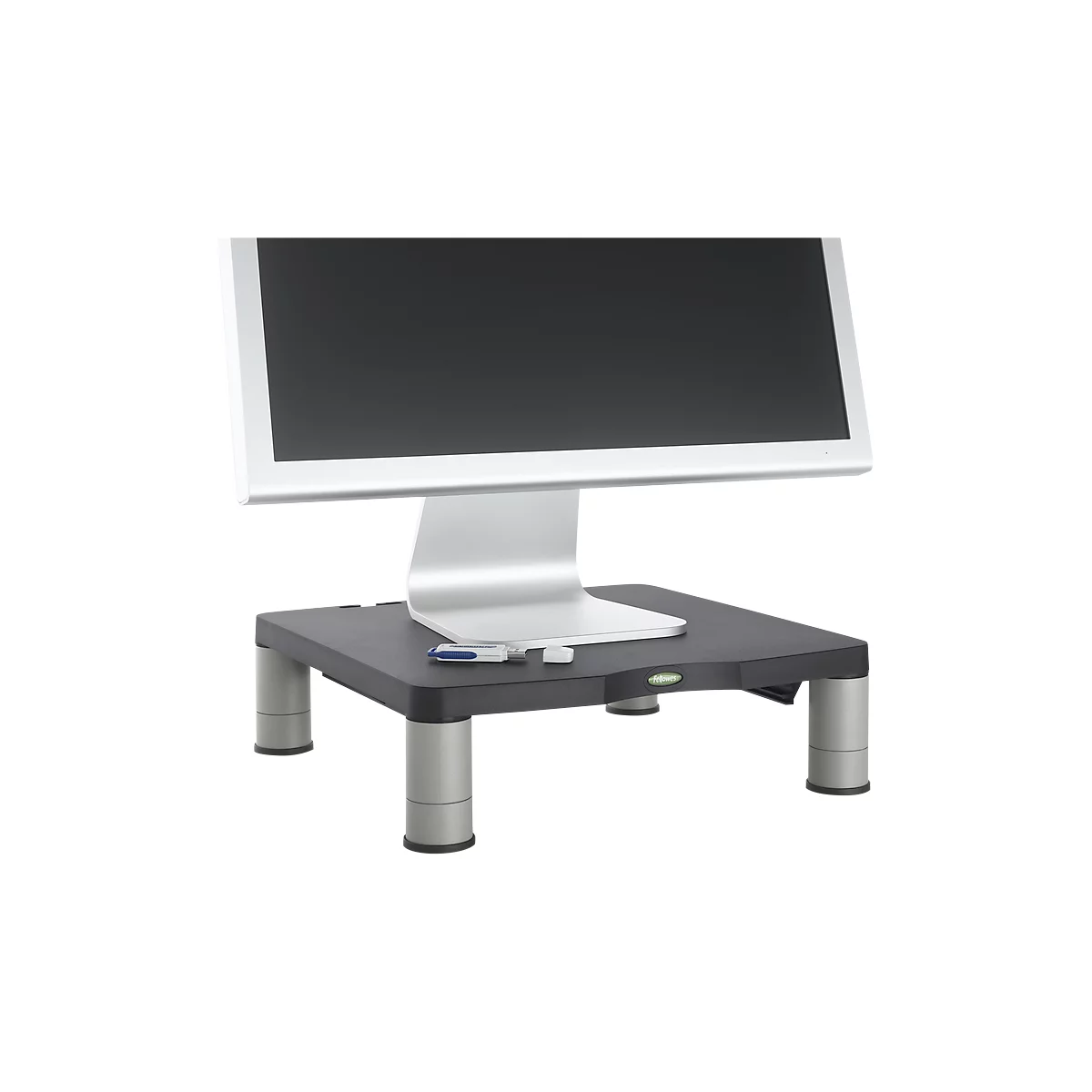 Monitor on black stand with USB stick. Silver frame, display black. Stand with silver legs.