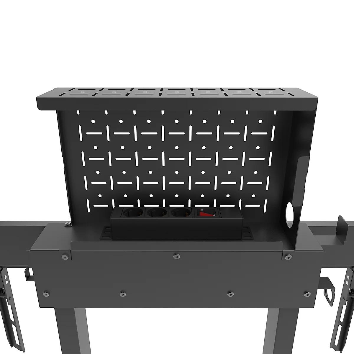 Close-up van een zwarte, metalen beugel met een patroon van gaten, de achterkant is open. Onderaan is een stekkerdoos te zien.