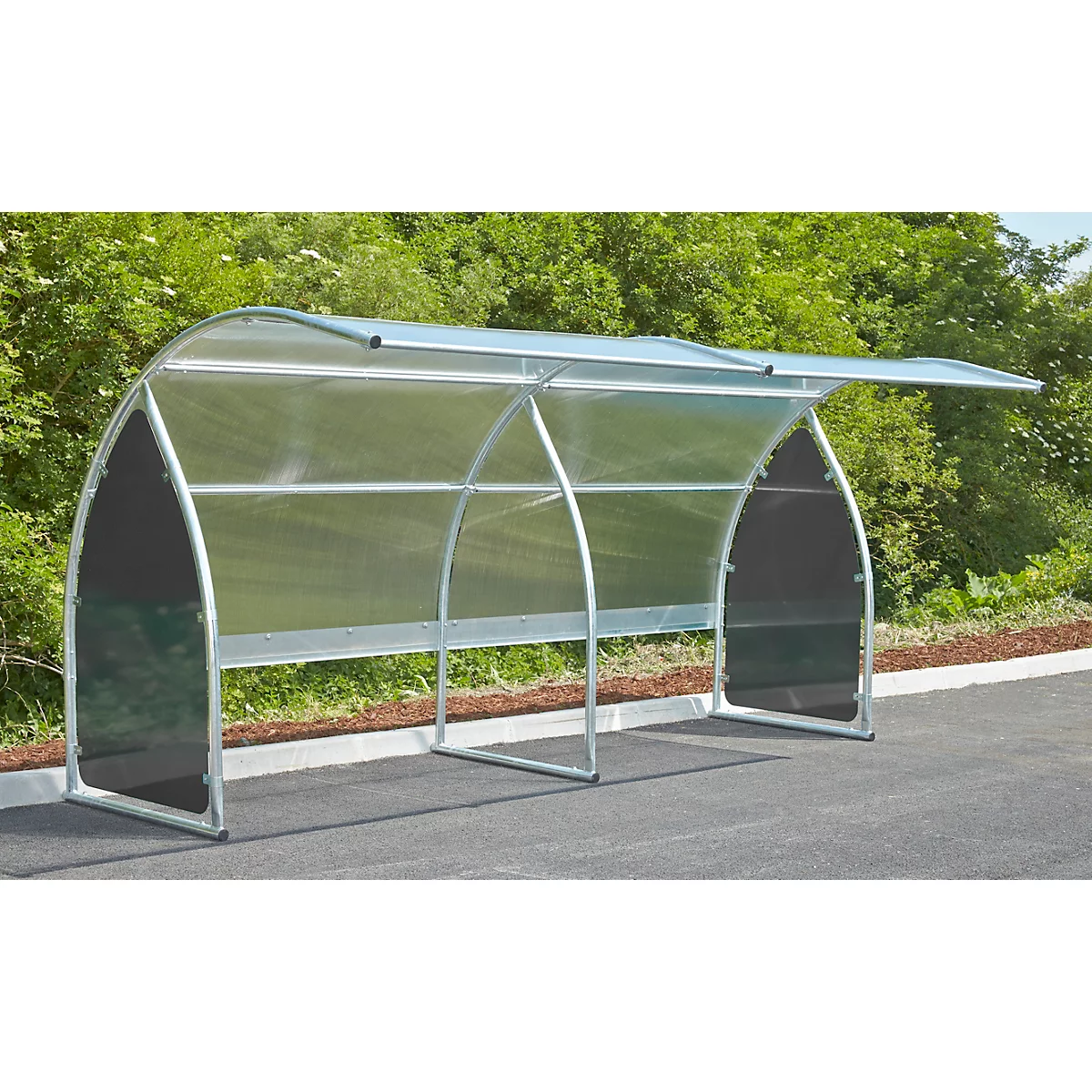 A transparent bus stop shelter with metal frame. The stop offers protection from rain.
