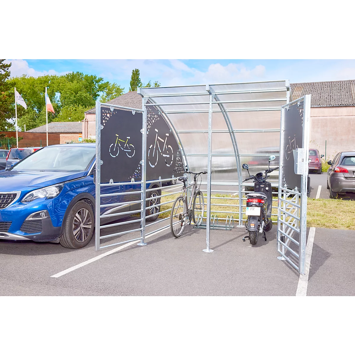 Bike shelter with bicycle and scooter. Blue car next to it.