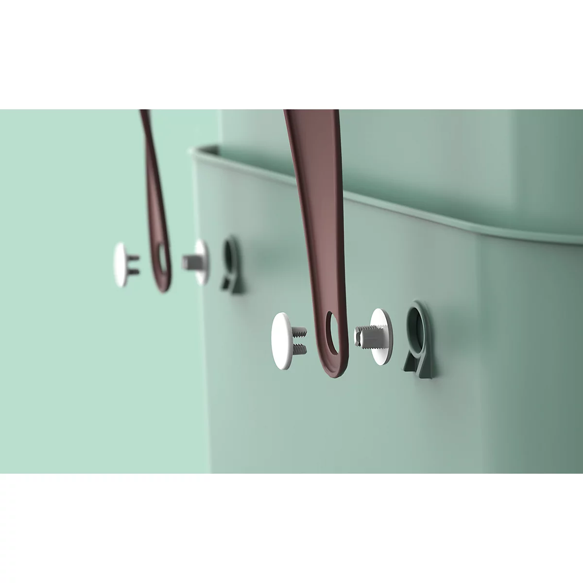 Close-up of detail: handle attachments on a green container, brown handles.