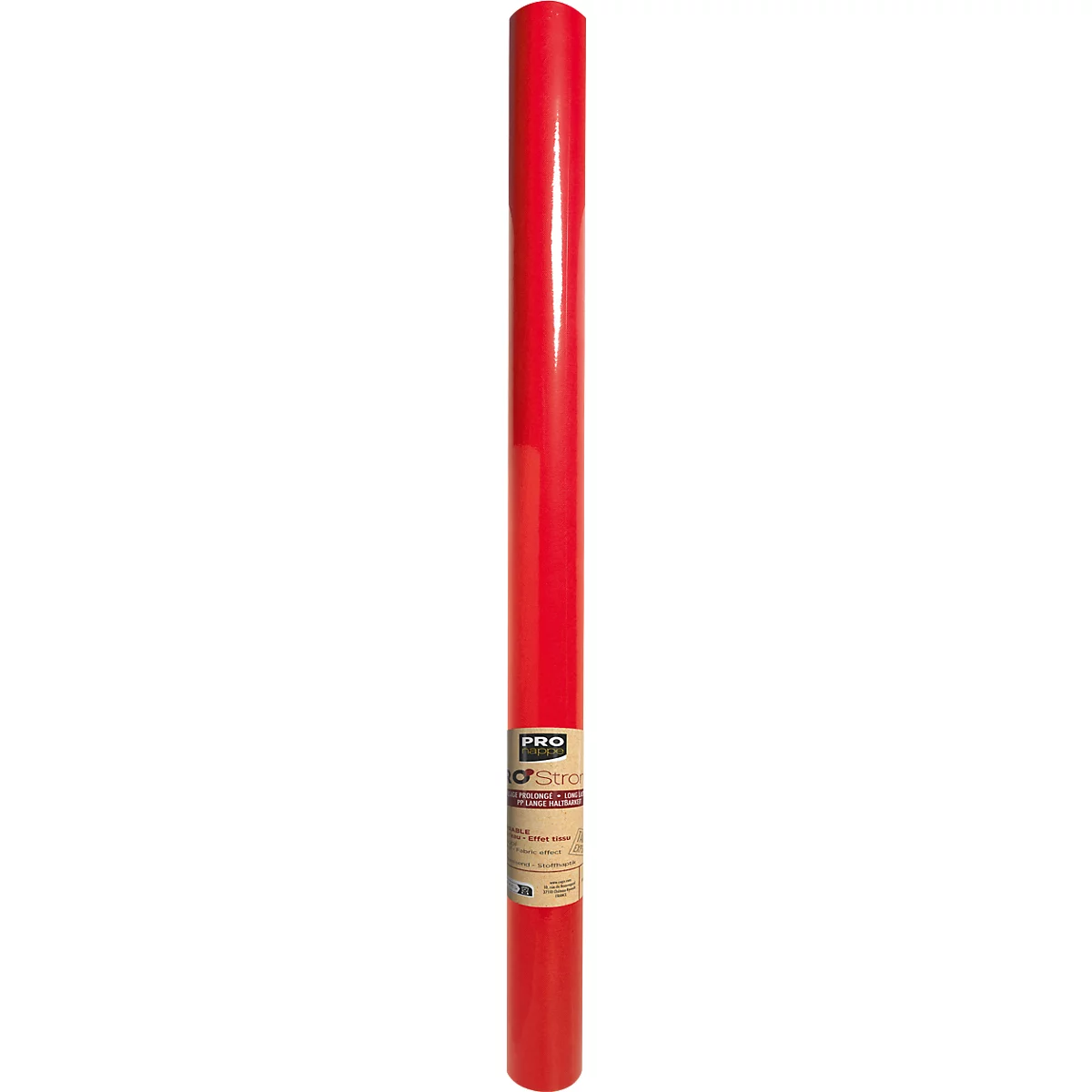 Forme cylindrique rouge, avec une étiquette blanche avec du texte brun et noir. L'arrière-plan est flou.