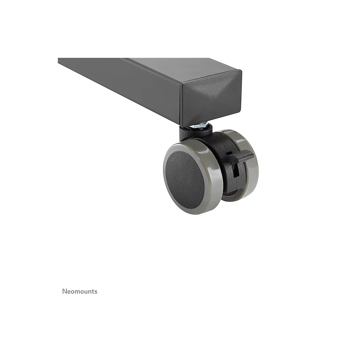 Detailaufnahme einer schwarzen Möbelrolle mit grauem Rad und Hebel. Im Hintergrund ist ein graues Rechteck zu sehen.