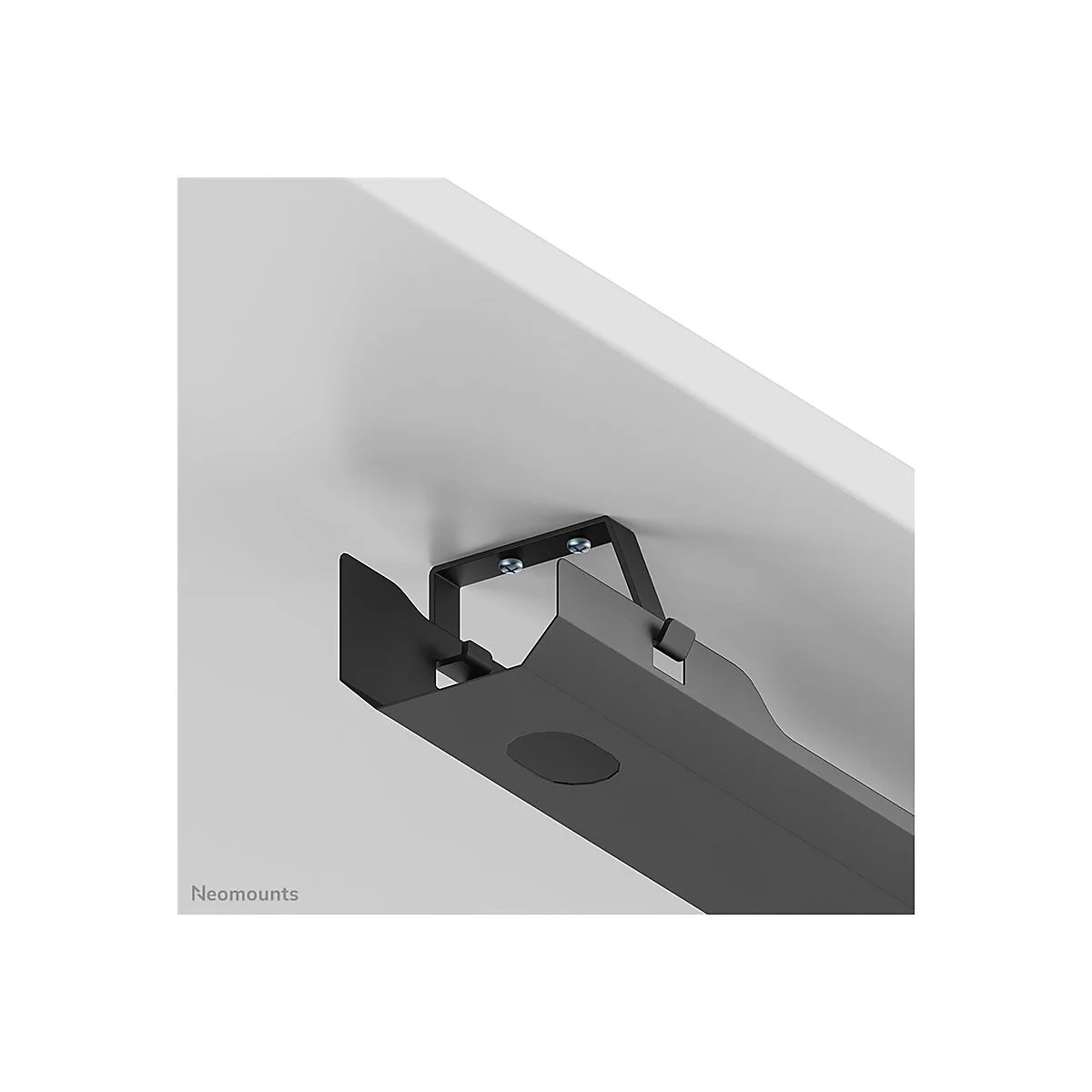Schwarze Halterung für Bildschirmkabel, an weißer Tischplatte befestigt.