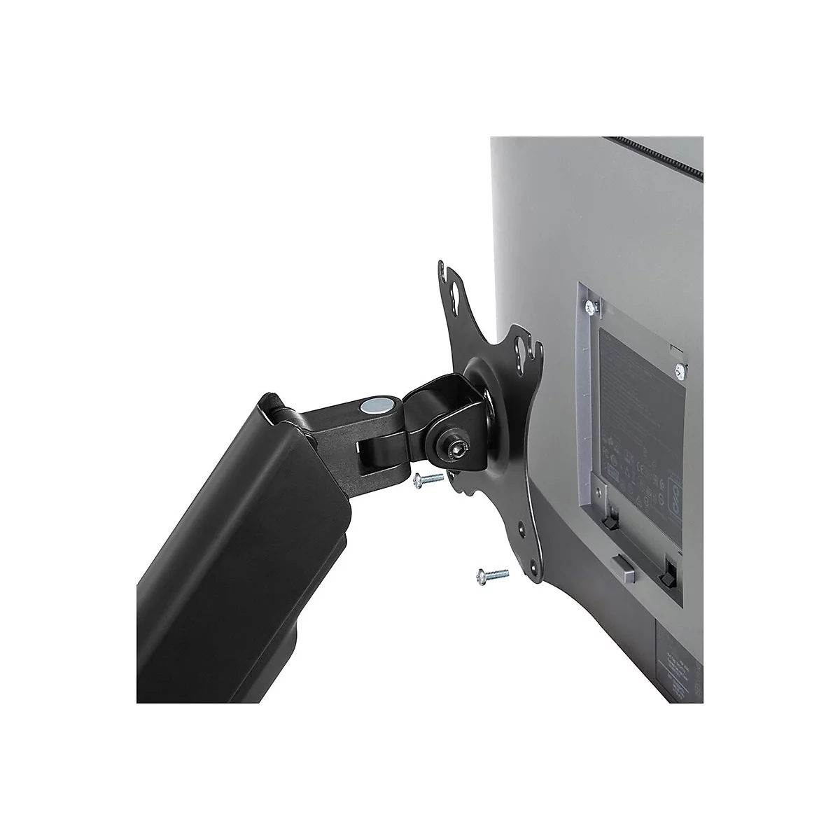 Gros plan d'un support de moniteur noir fixé à l'arrière d'un moniteur gris. Des vis sont prêtes.