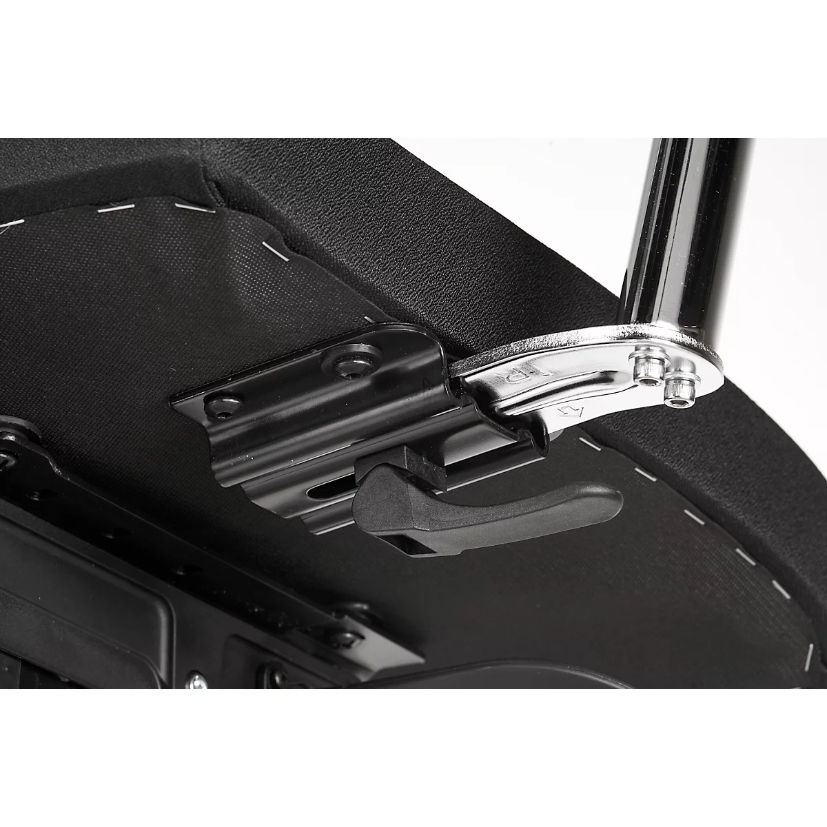 Close-up of the underside of a piano stool. Black padding, metal parts, and a black lever for height adjustment.