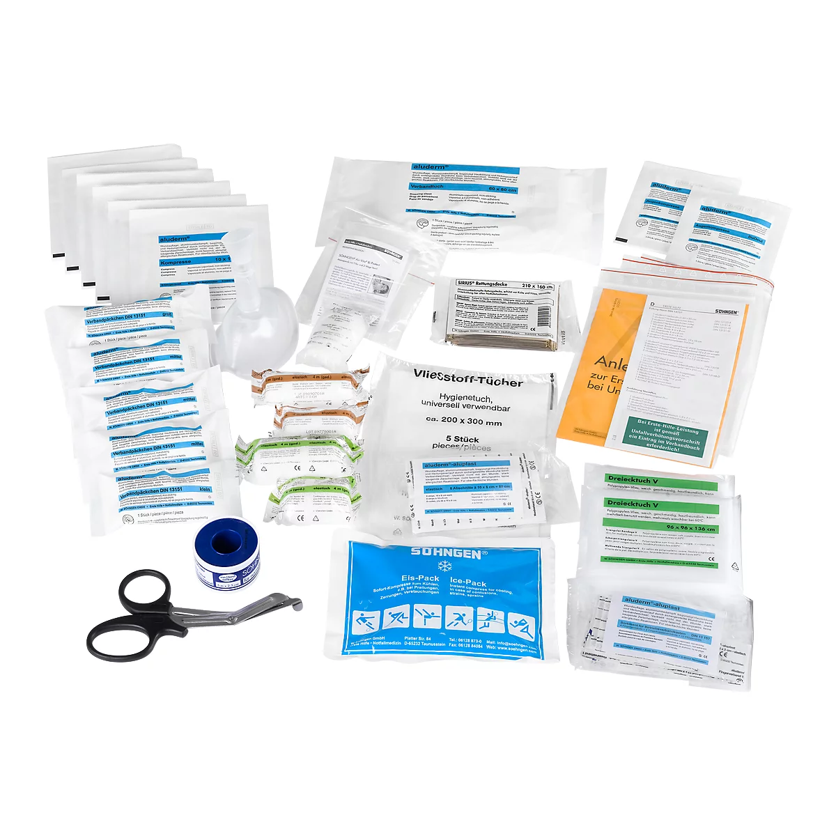 Primer plano de equipo médico, que incluye vendas, hisopos, tijeras e instrucciones.