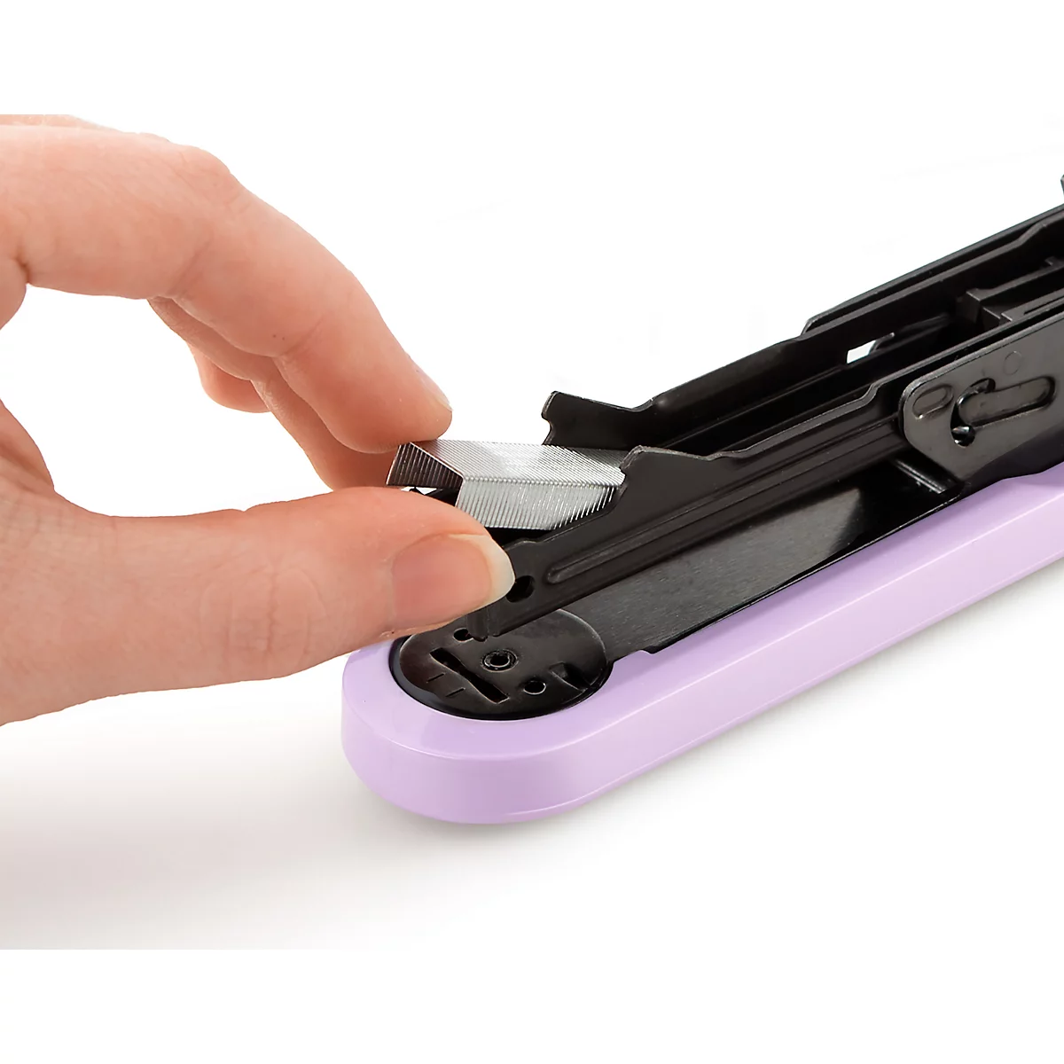 Close-up of a hand placing a staple into a purple stapler.