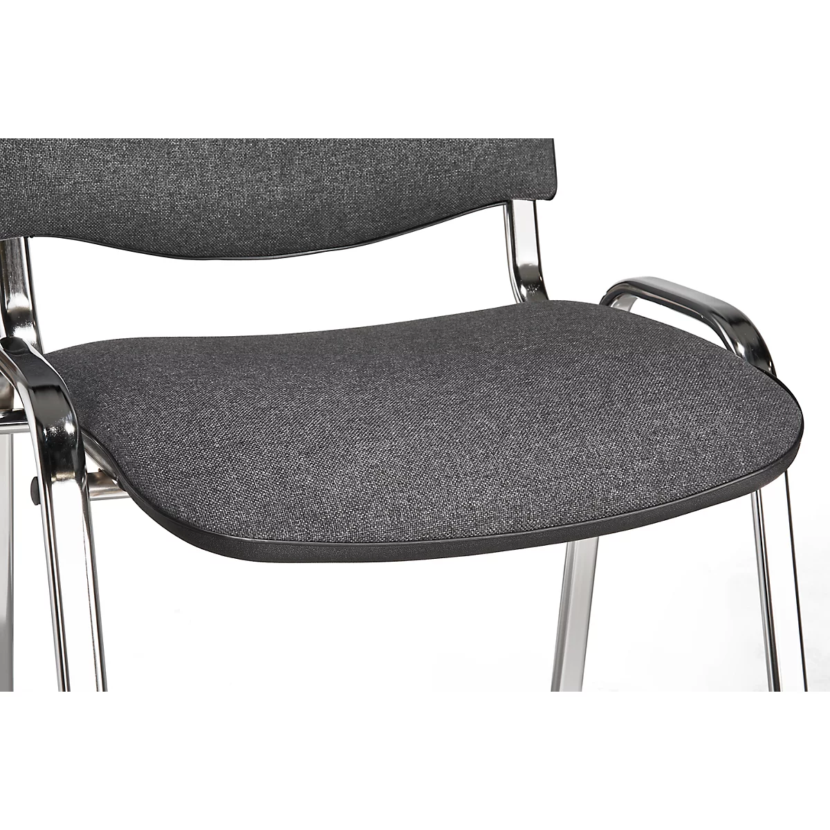 Close-up of a gray fabric chair with a chrome frame. The seat has a rounded shape with black edges.