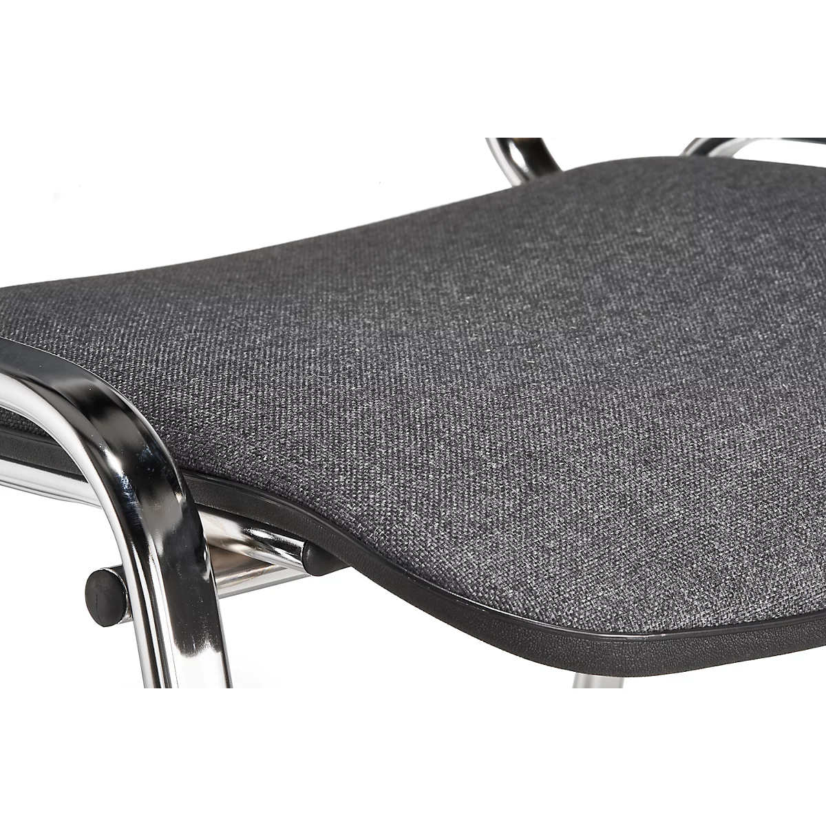 Close-up of a chair seat with grey fabric cover and metal frame.