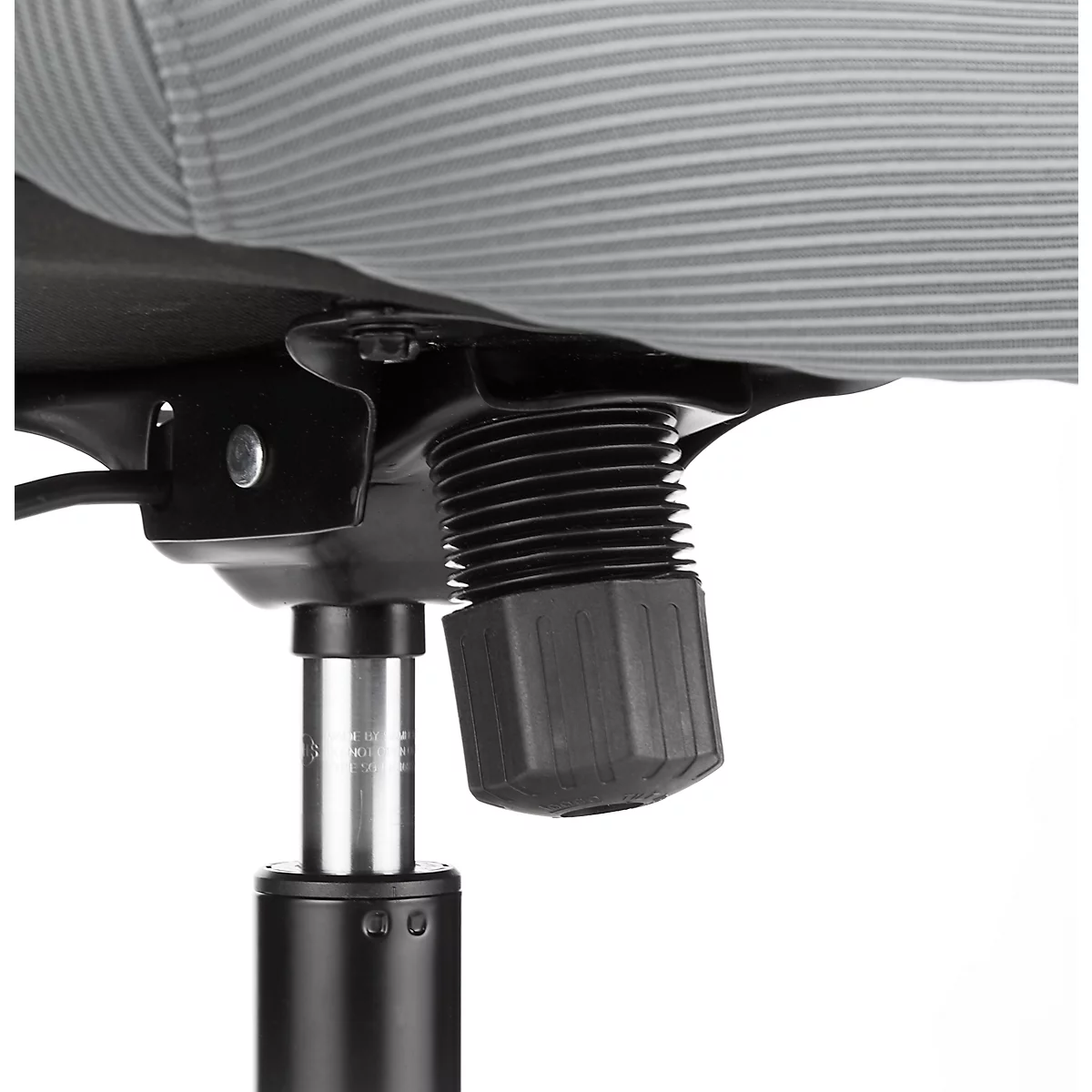 Close-up of black office chair, focus on the height adjustment mechanism.