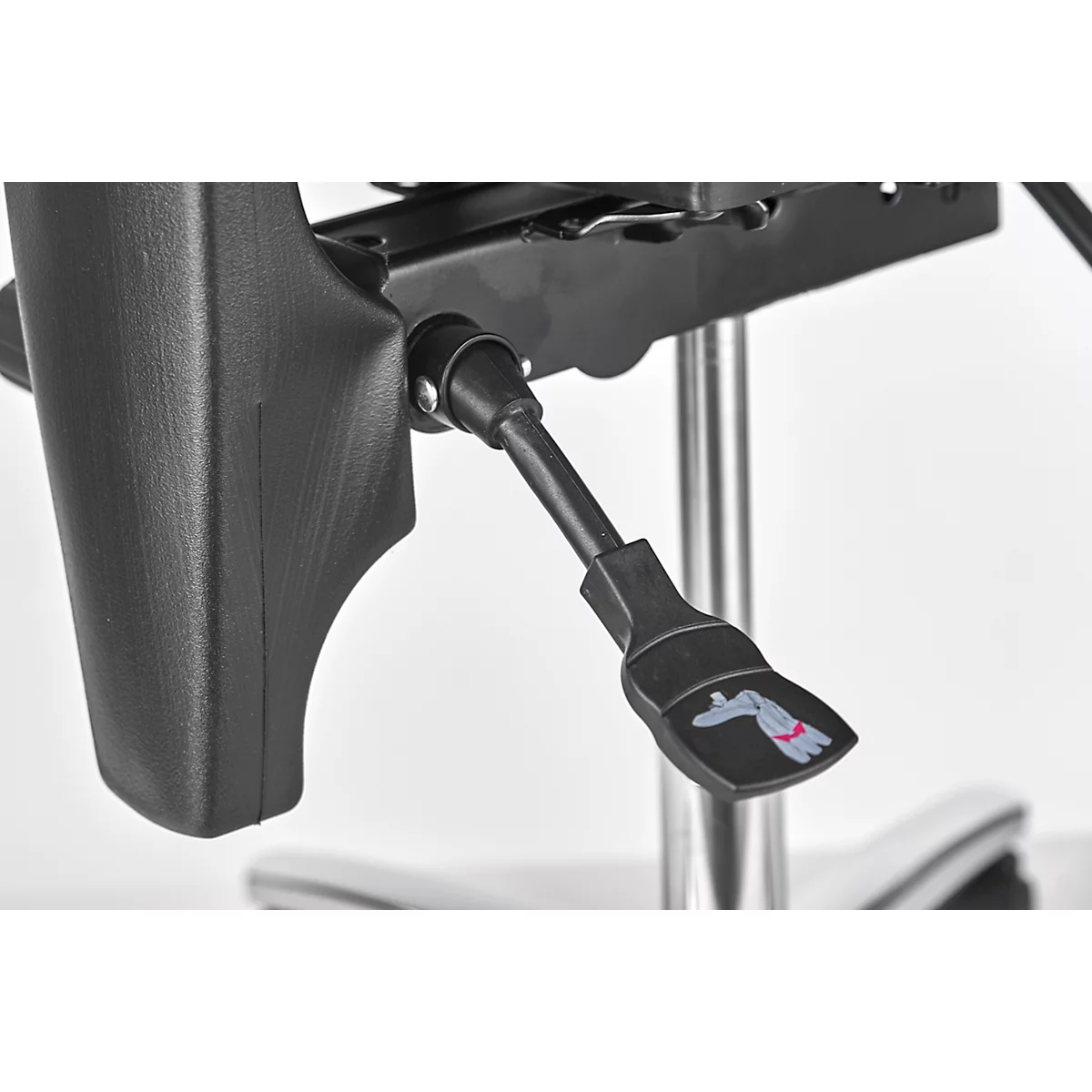 Close-up of a black chair with a lever with a hand symbol. The chair stands on a polished foot.