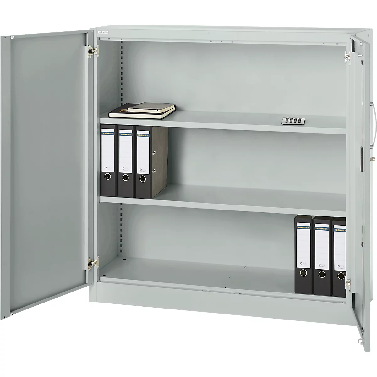 Open, grey steel cabinet with two doors and three shelves. There are folders, a notebook and a small black object on the shelves.