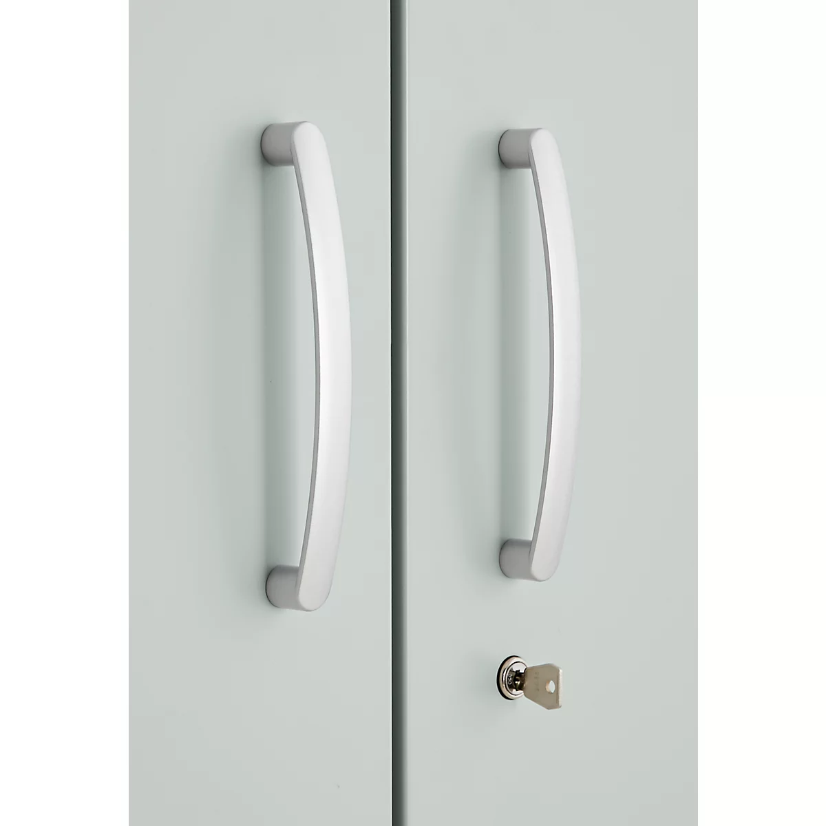Two silver door handles on a light blue cabinet door, below a keyhole with key.