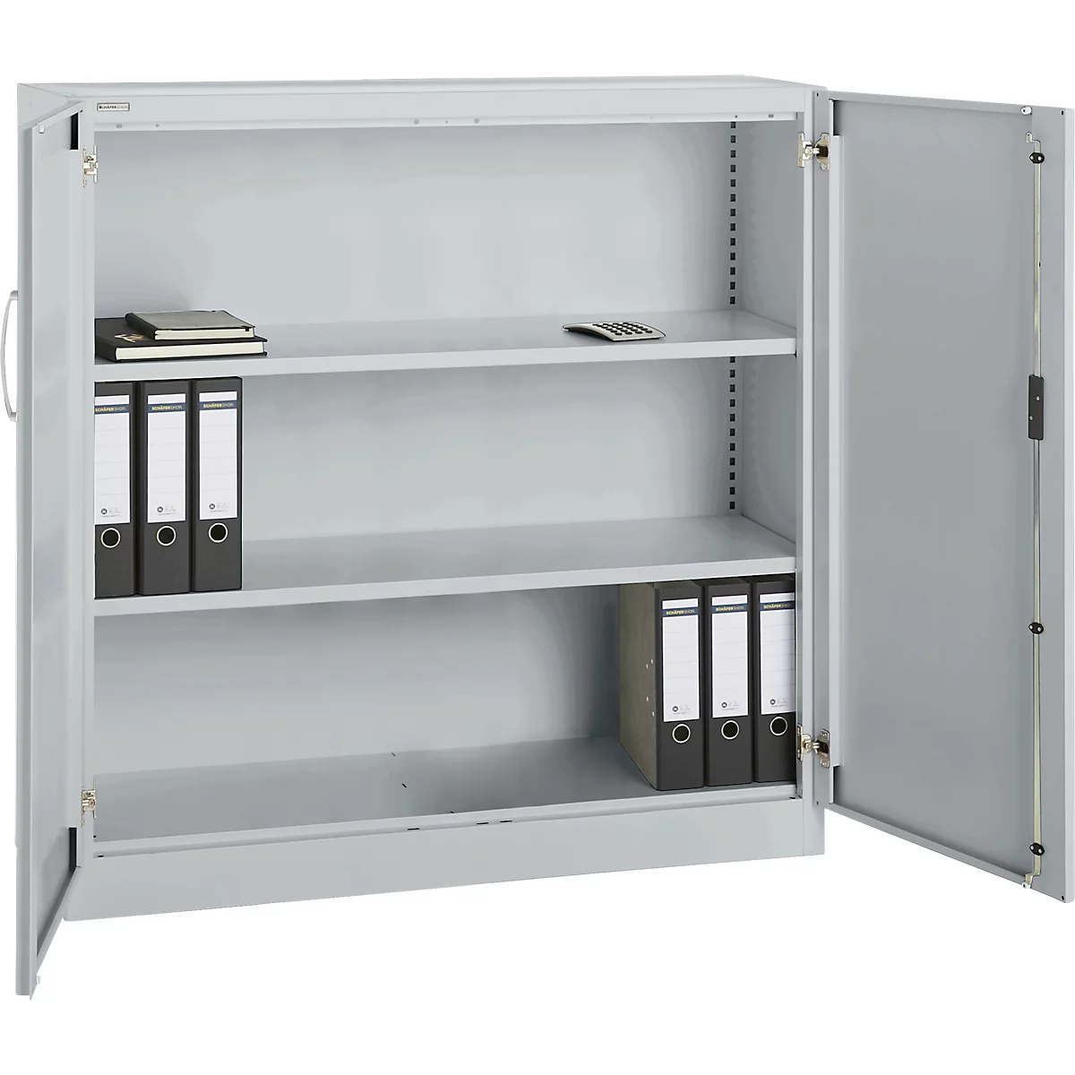 Gray filing cabinet with open door, filled with file folders, a notepad, and a calculator on the shelves.