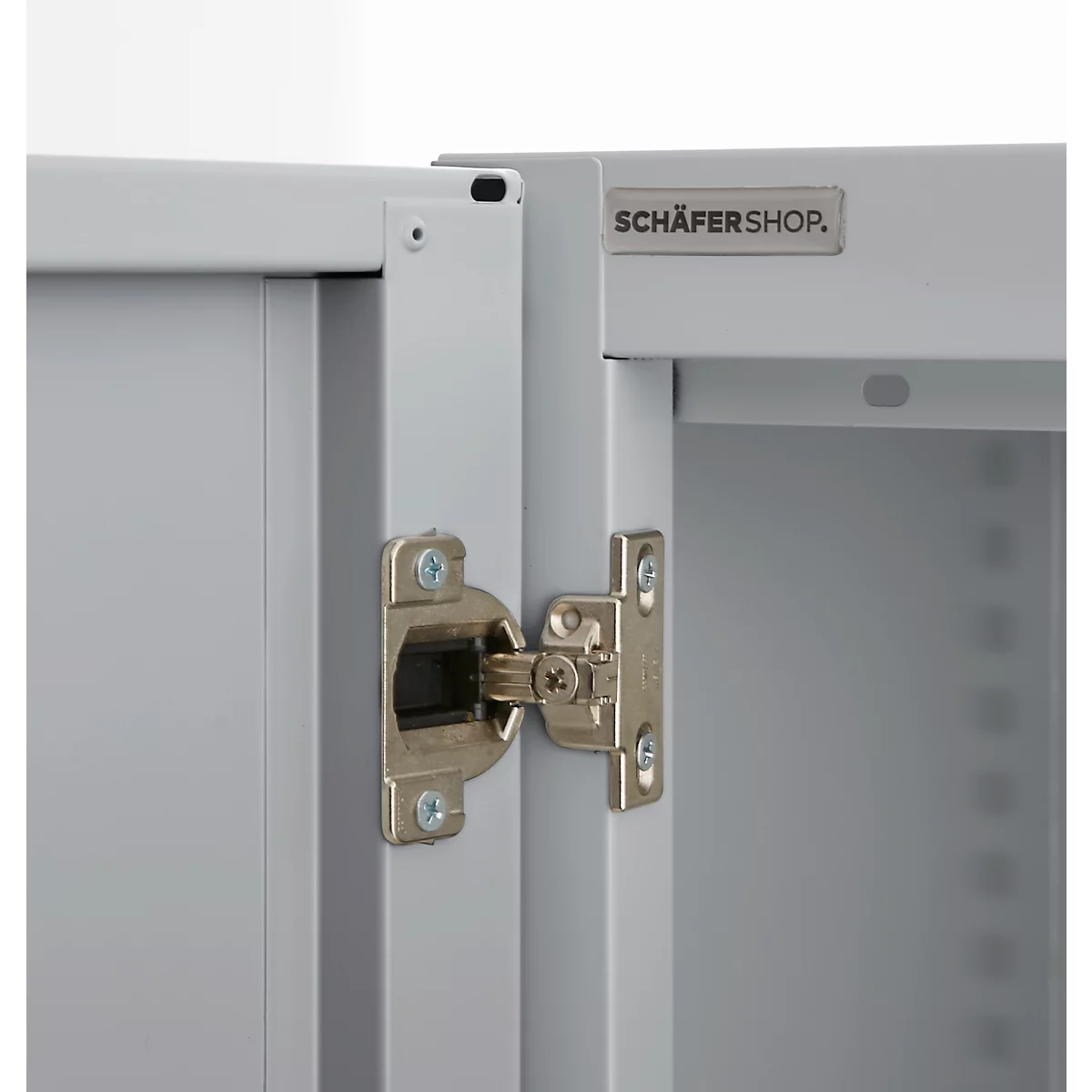 Close-up of a cabinet showing the hinge and the 'SCHÄFERSHOP' logo.
