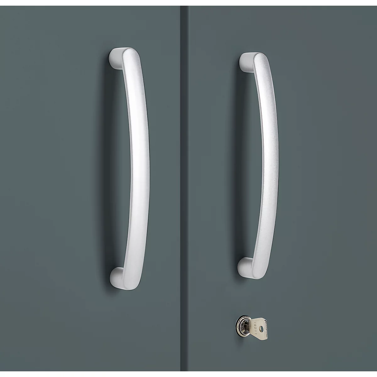 Close-up of cabinet doors with two silver handles and a keyhole.