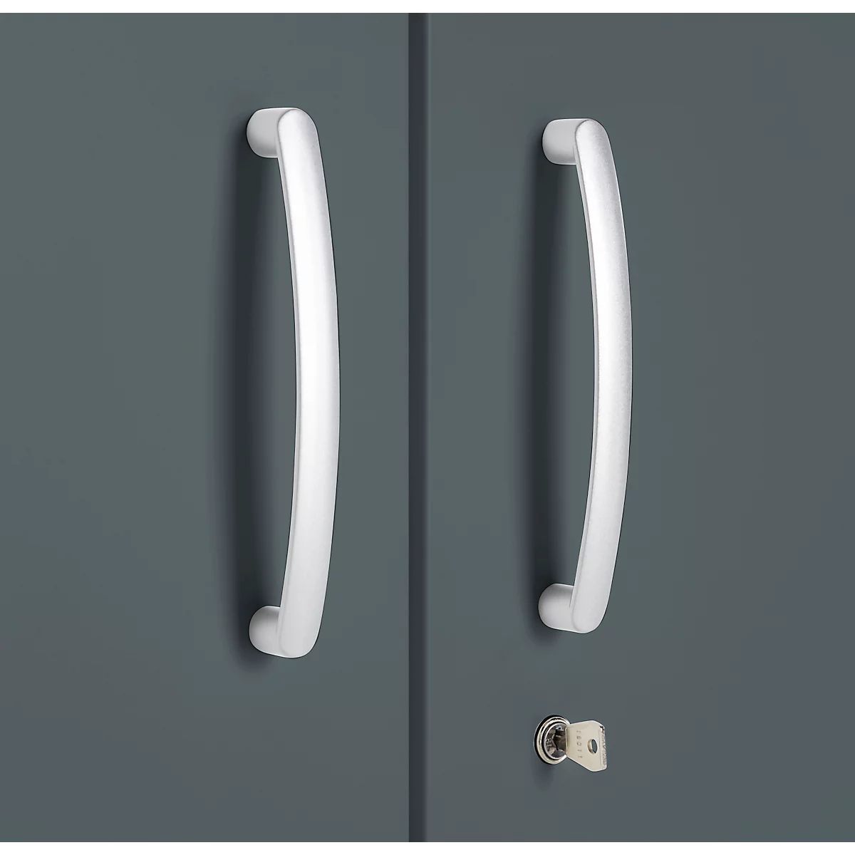 Two white, curved door handles on a gray cabinet door. Below, a keyhole with a key.