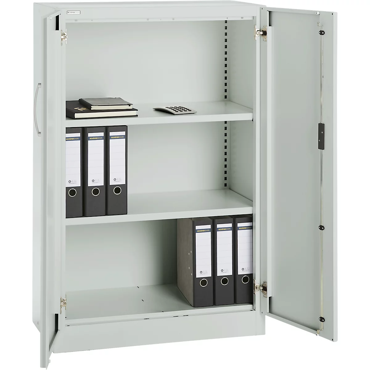An open, grey steel cabinet with three shelves. Folders, notepad, and calculator are on the shelves.