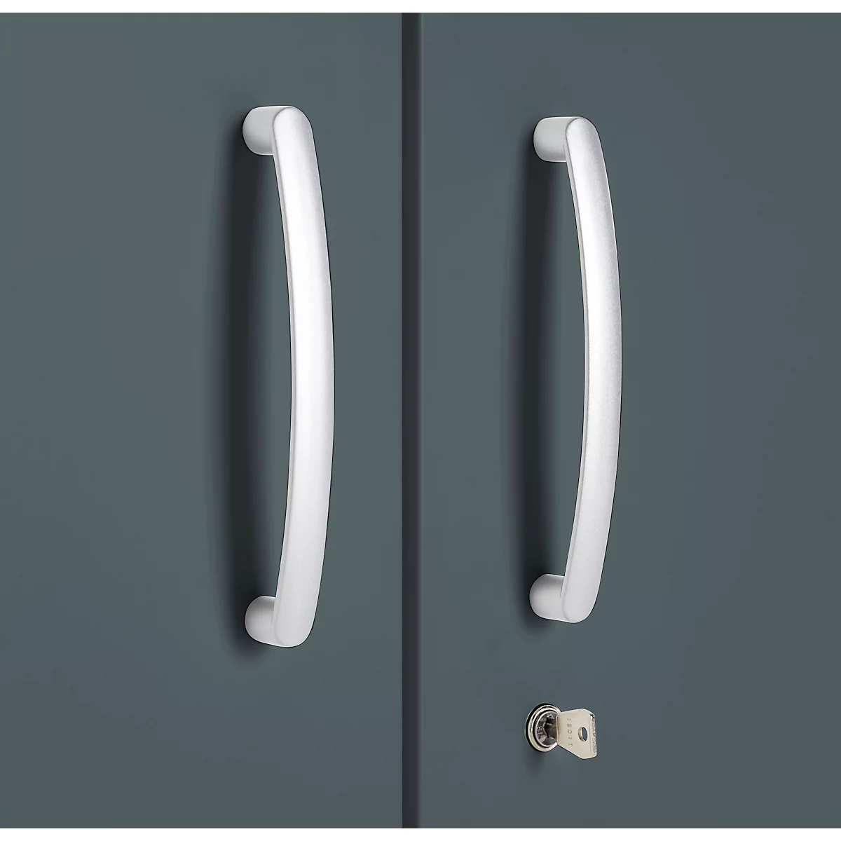 Two silver bar handles on a dark gray cabinet door. Below a keyhole with key.