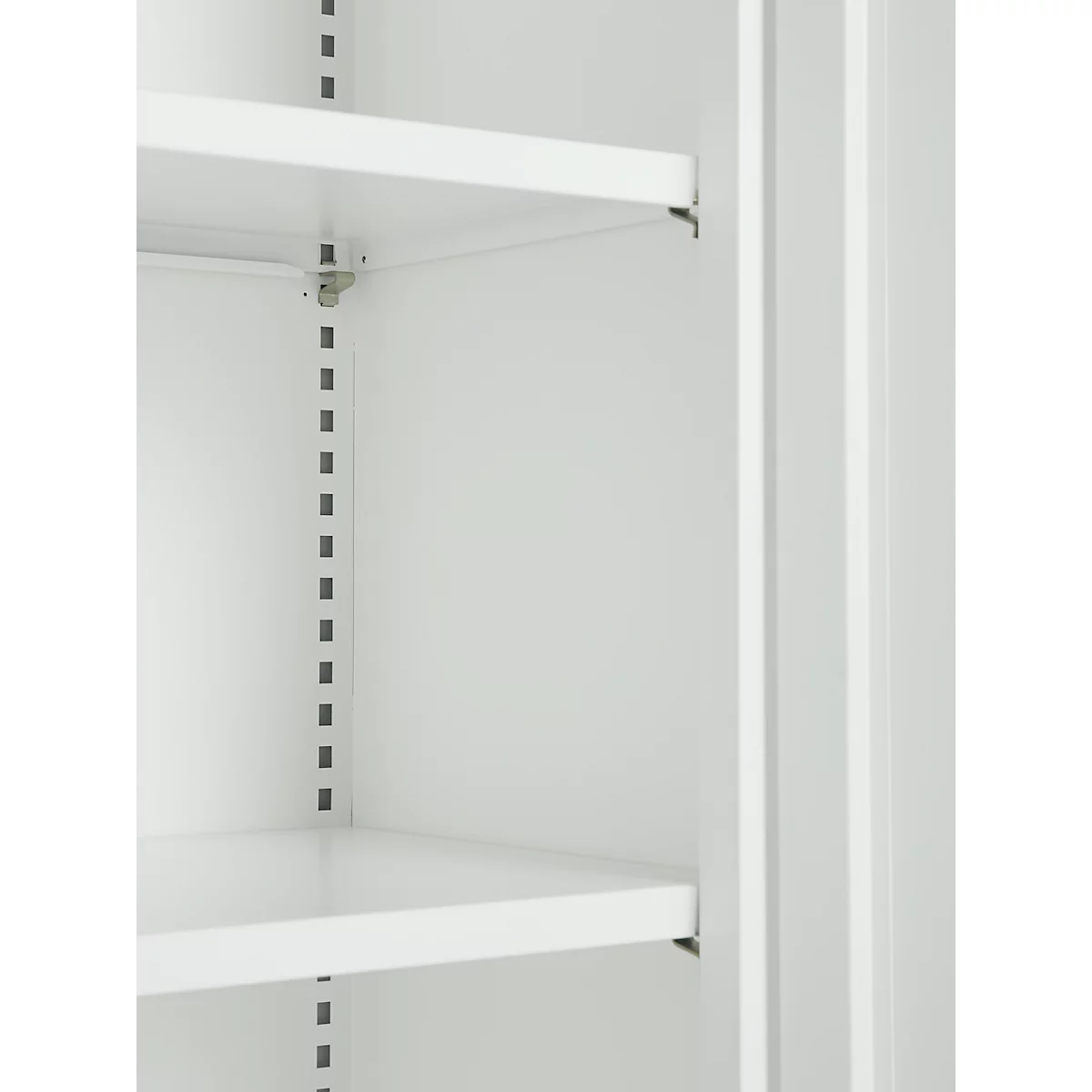 Close-up of an empty, white cabinet with shelves. Vertical rows of holes for shelf supports.