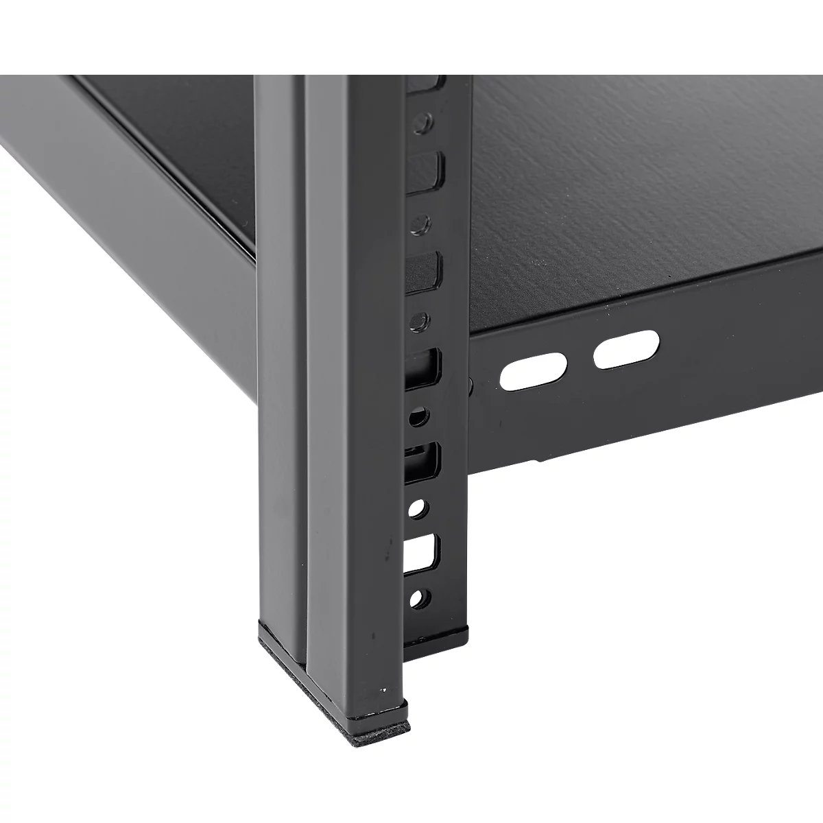 Close-up of a corner of a black metal shelf, with perforations and recesses for fixing.