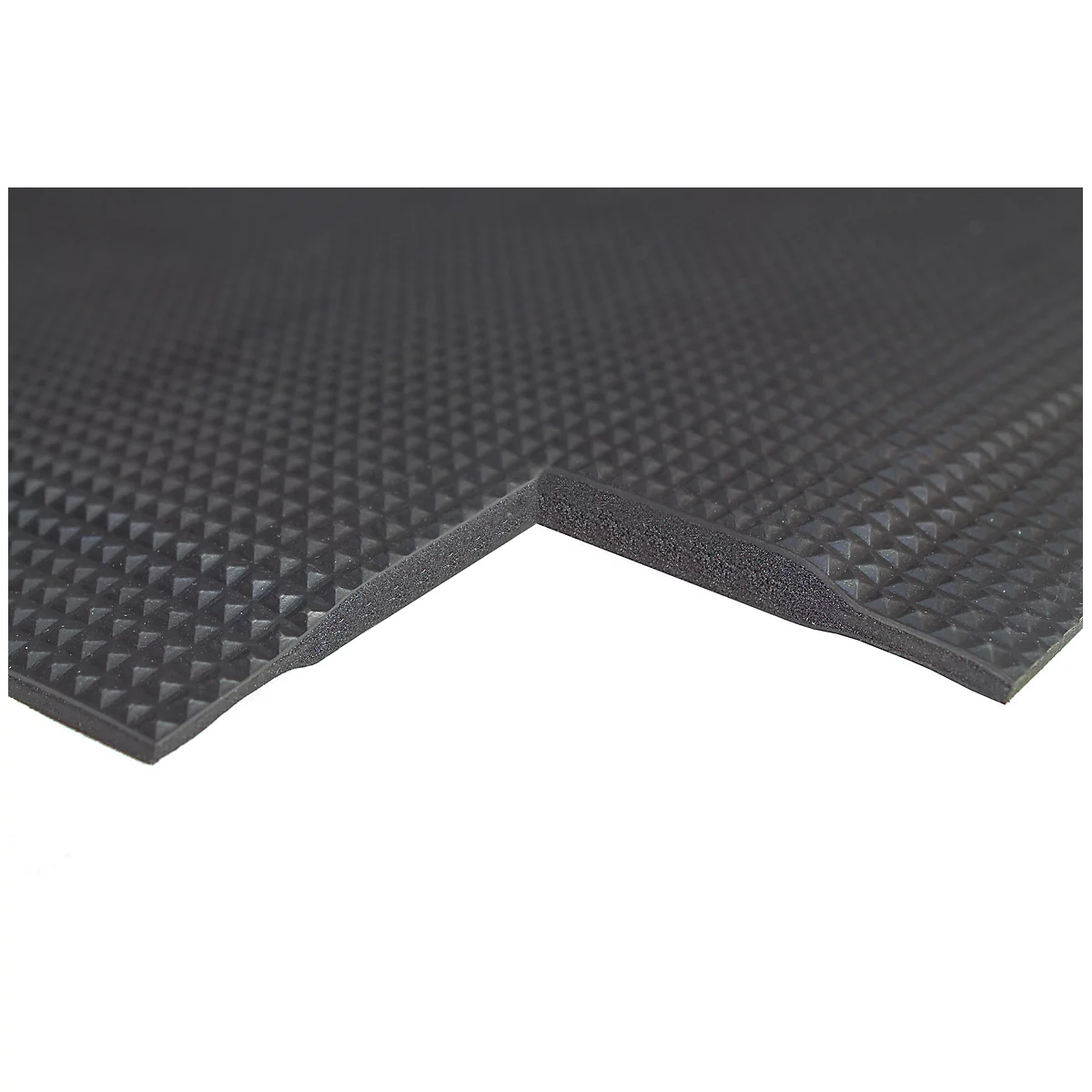 A black rubber mat with raised, diamond-shaped patterns. The edge is cut to show the layering.
