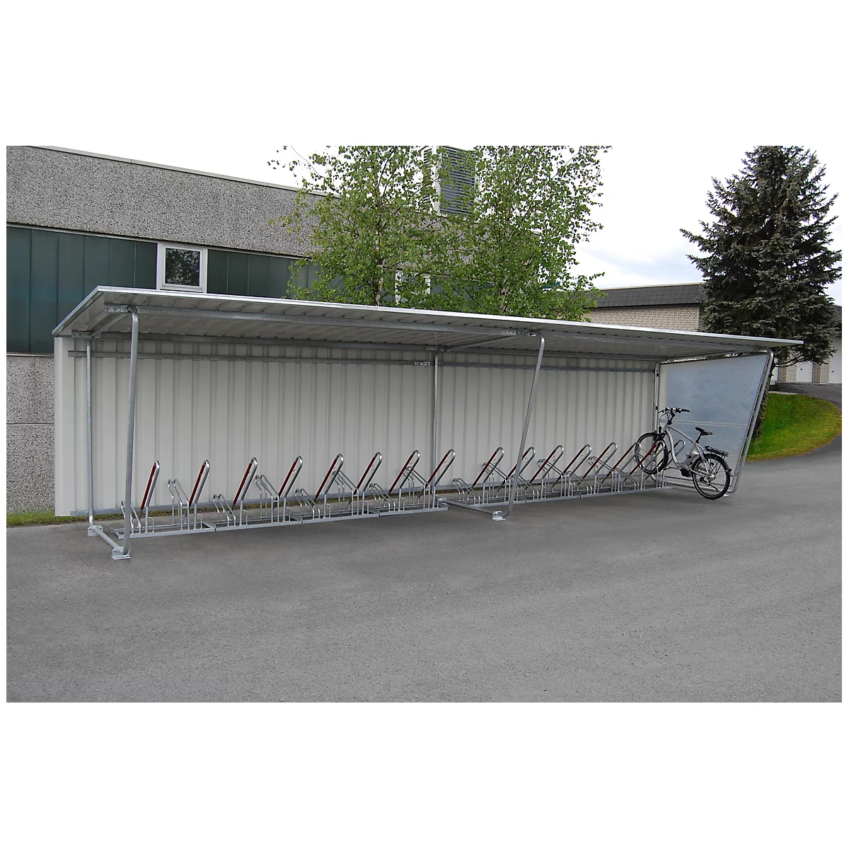 Bike shelter with bikes. One bike is ready for parking.