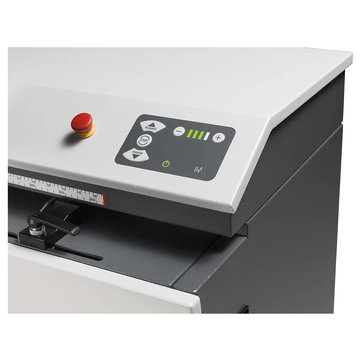 Detailed view of a machine with a red emergency stop button and control panel with green LEDs.