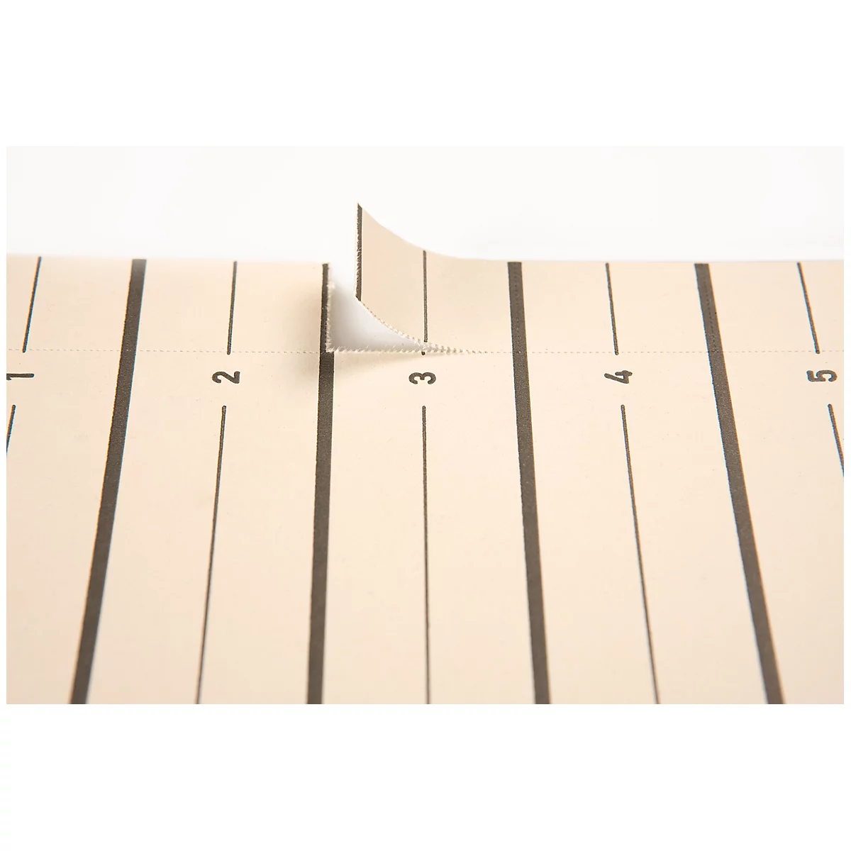Detail of a beige paper sheet with black lines and numbers. At number 3, a part is torn off and folded up.