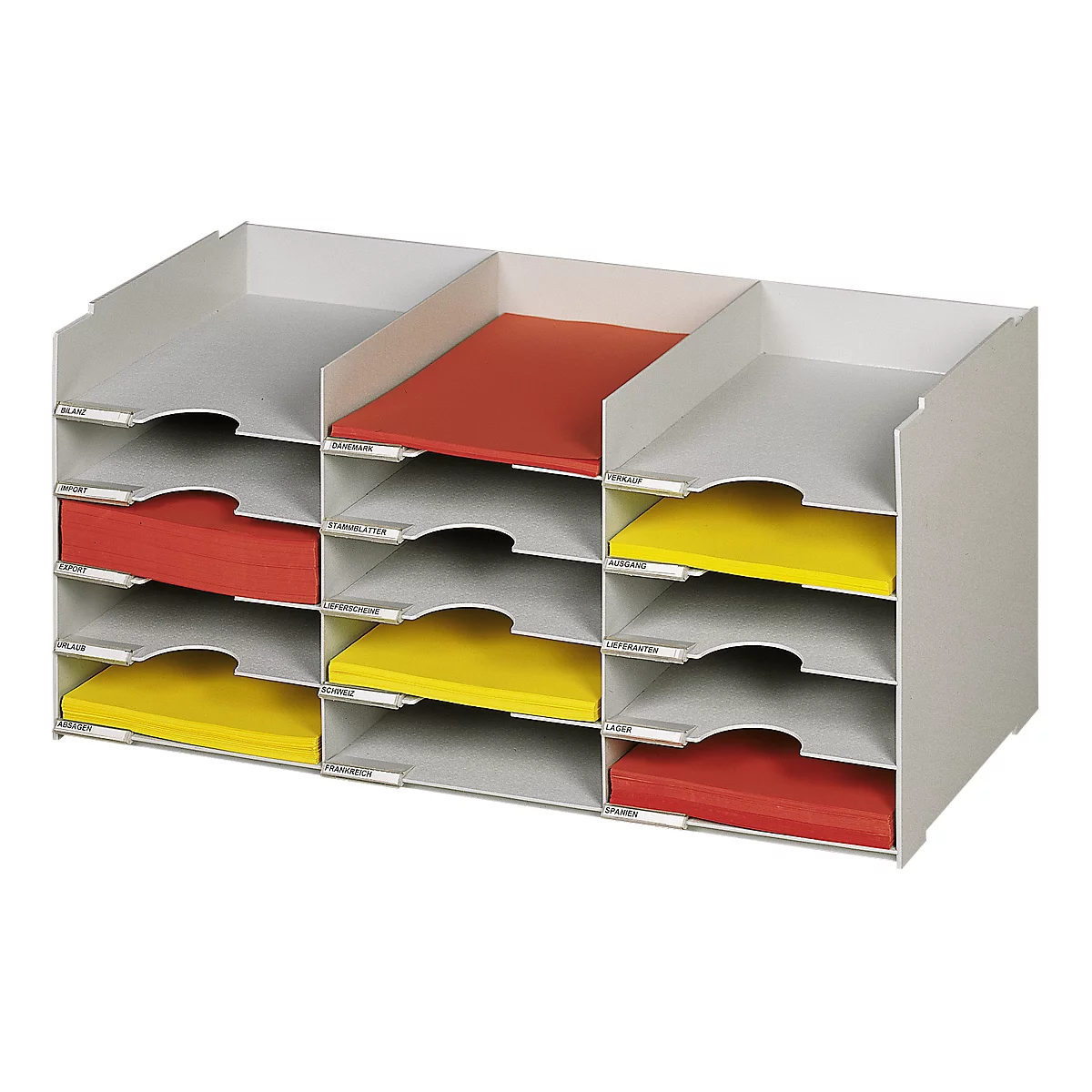 Grey, nine-compartment desk organizer filled with red and yellow papers. Each compartment has a small label.