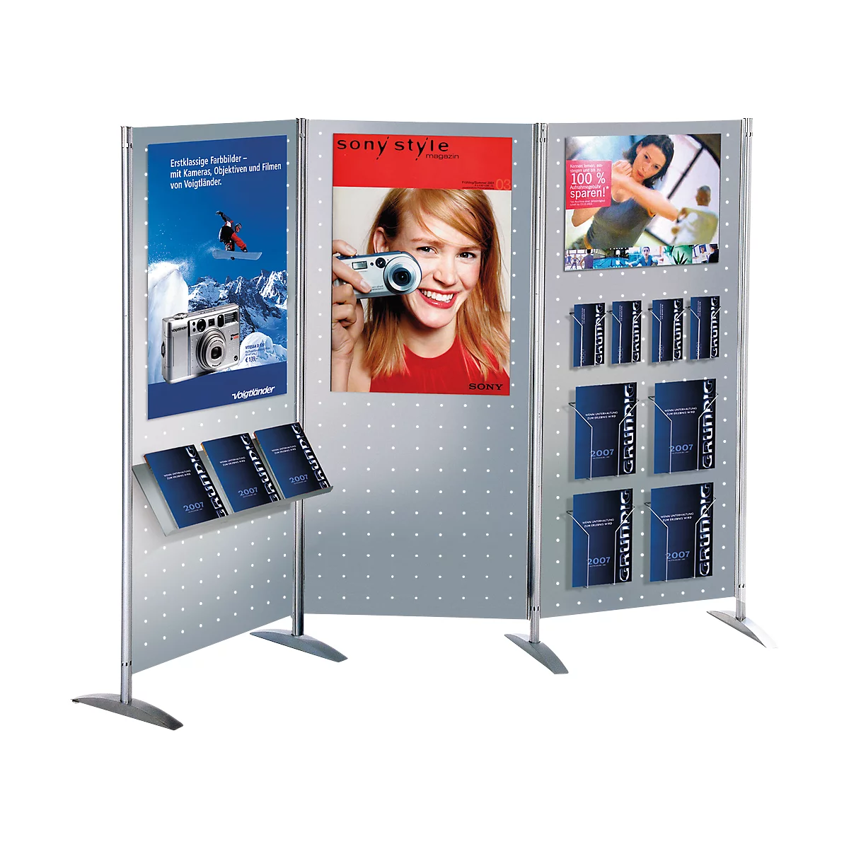 Display with advertising and brochures. One display shows a woman with a camera. Several holders with brochures.