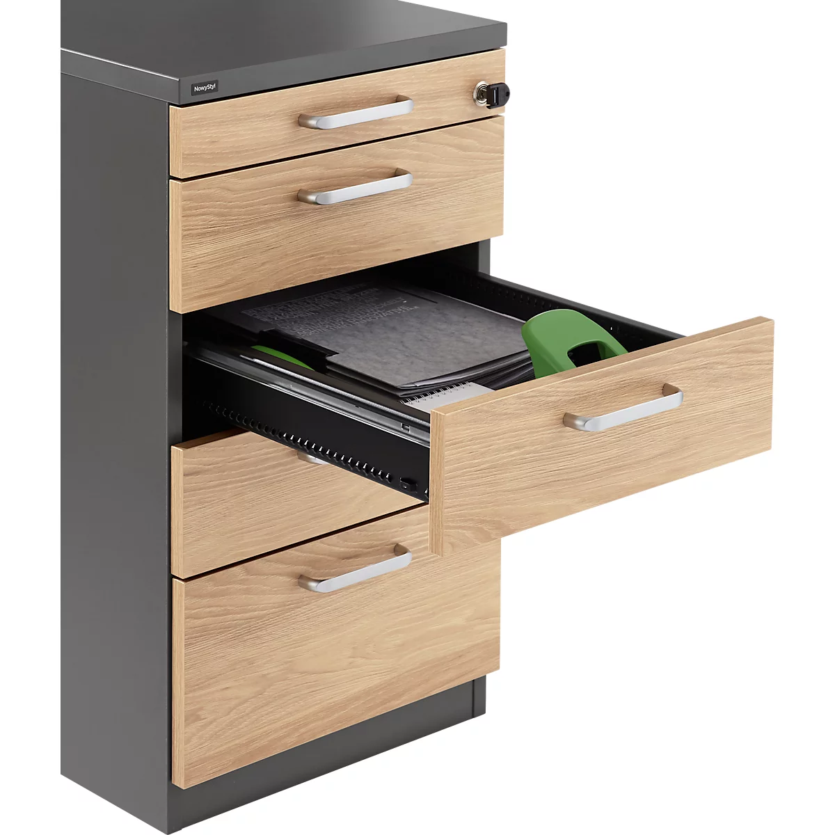 Chest of drawers, one drawer is open showing storage space with content.
