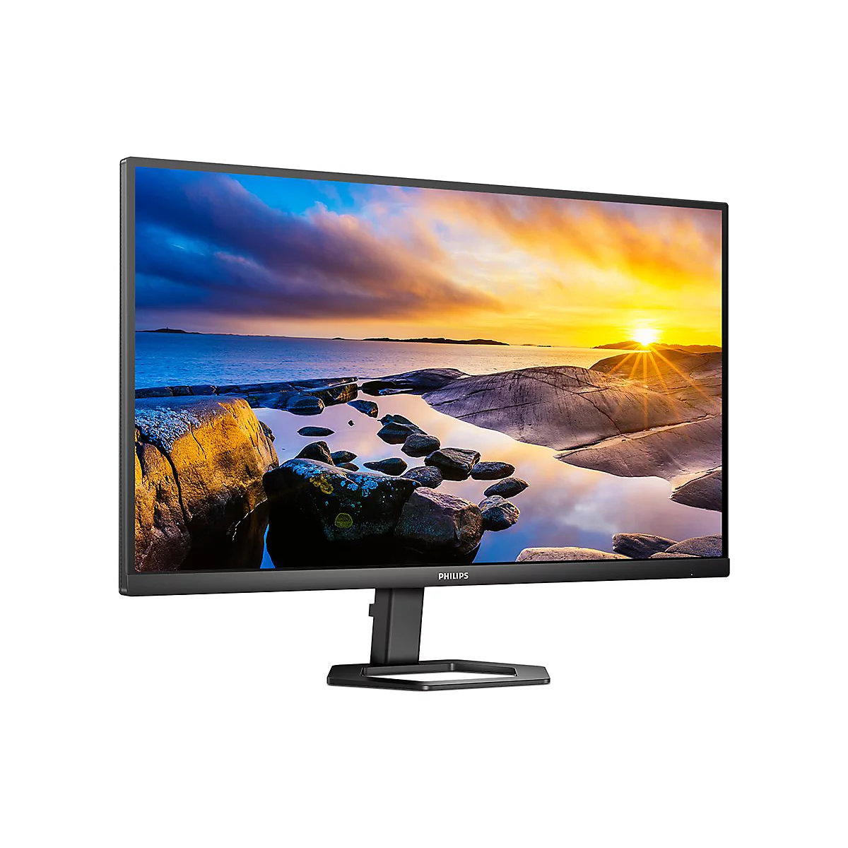 Ein schwarzer Computermonitor zeigt eine Landschaft mit Sonnenuntergang Ã¼ber dem Meer. Das Philips-Logo ist unten rechts sichtbar.