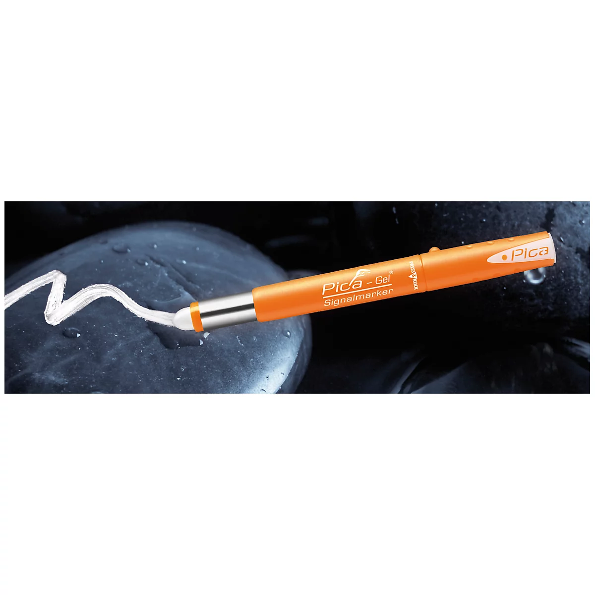 An orange Pica-Gel signal marker on black pebbles. The white color of the pen is shown on the stone.