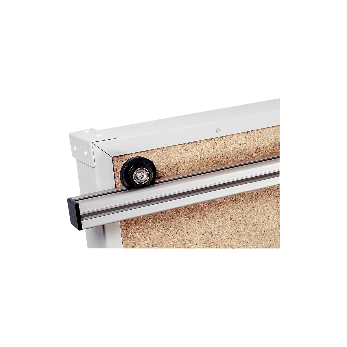 Close-up of a corner of a wooden board with a rail and roller system.