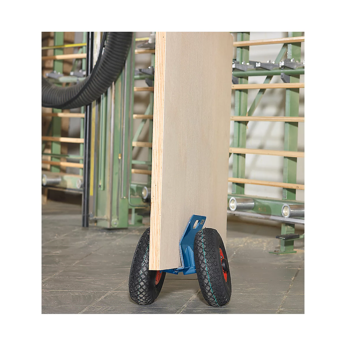 Plywood board on a transport cart with blue brackets and rubber wheels.