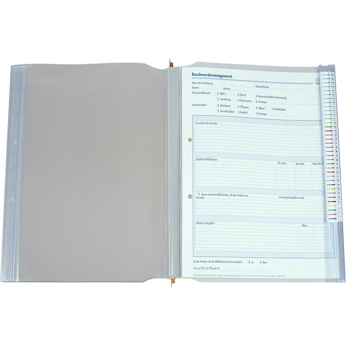 Classeur ouvert avec des feuilles perforées. Une feuille étiquetée est visible à droite. Il y a des onglets colorés.